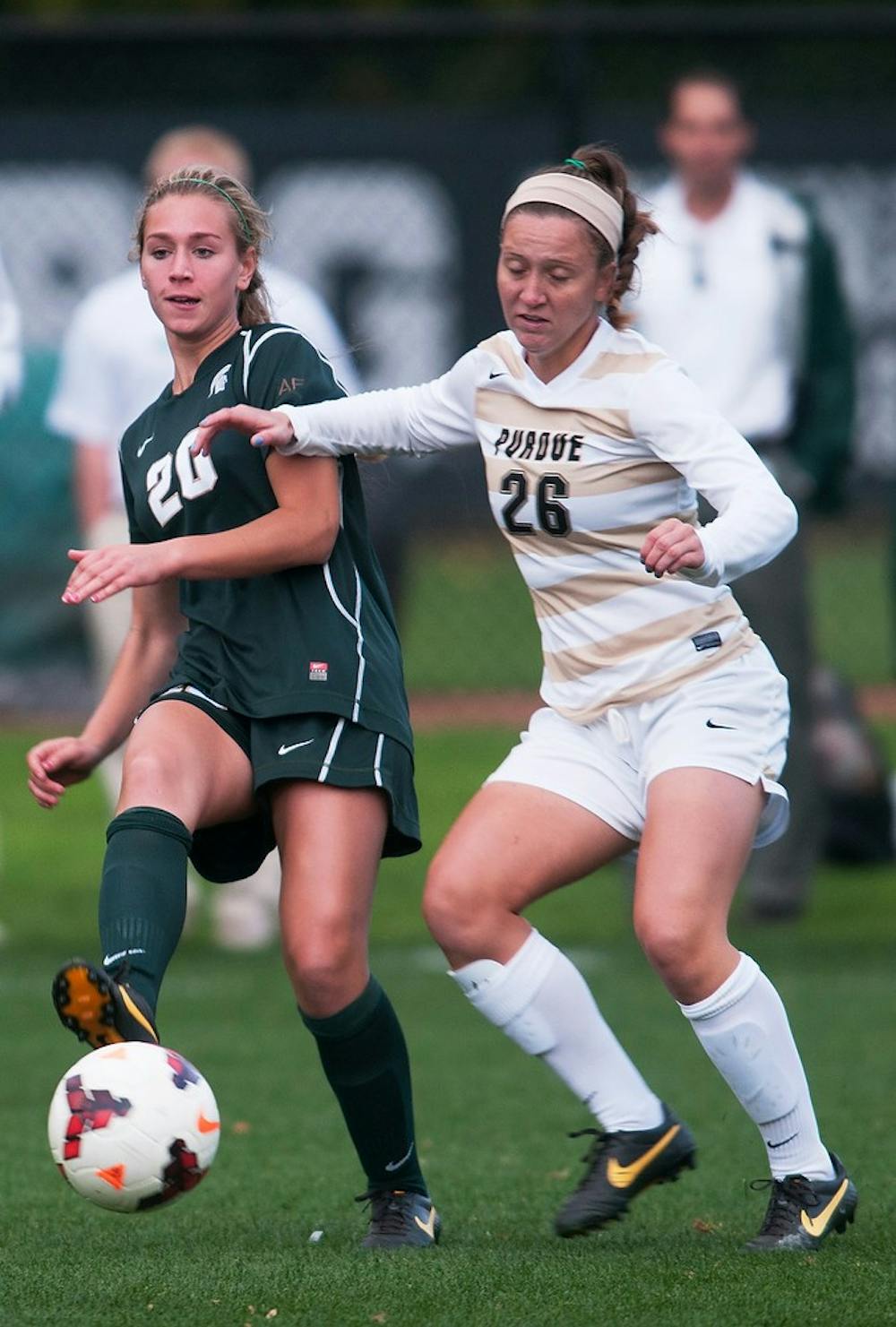 	<p>Sophomore midfielder Kristen Evans kicks the ball while Purdue defender Delia Repasky tries to block the pass during the game Oct. 18, 2013, at DeMartin Stadium at Old College Field. The Spartans defeated the Boilermakers, 4-0. Georgina De Moya/The State News</p>