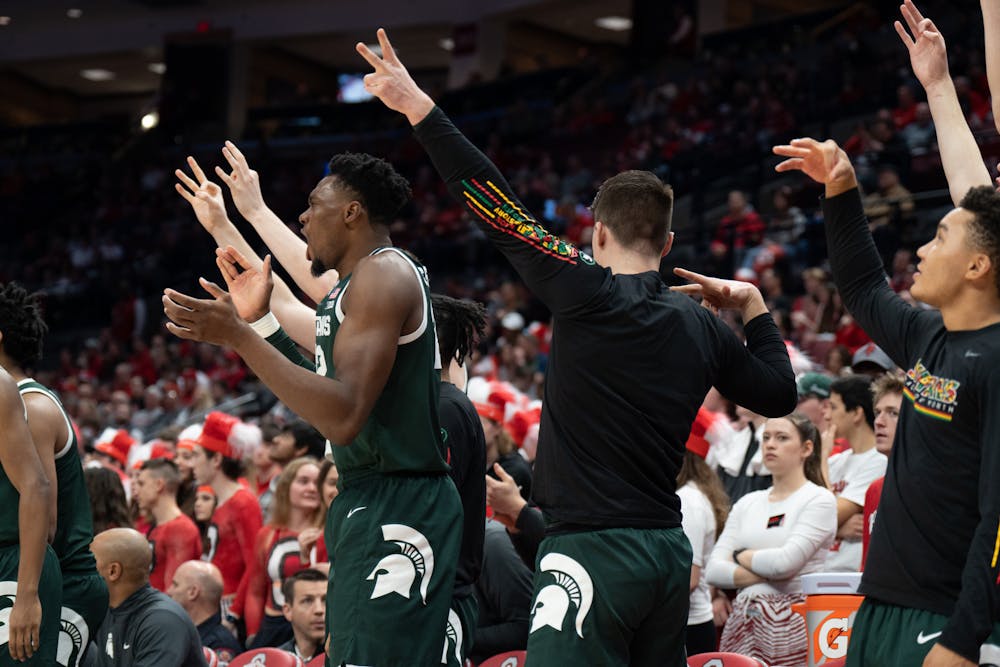 The Spartan sideline erupts in celebration after MSU scores a bucket at the Schottenstein Center in Columbus, Ohio on Sunday, Feb. 12, 2023. Visiting team Michigan State beat Ohio State by 21 points.