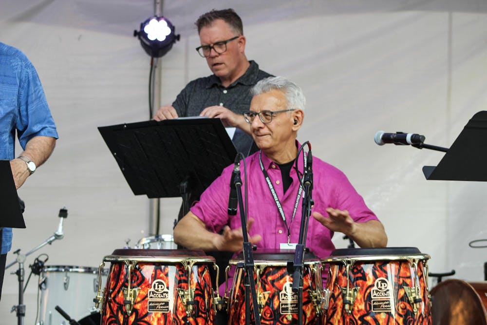 A bangos player, a member of Aguanko, warms up at the East Lansing Summer Solstice Jazz Festival on June 21, 2024. 