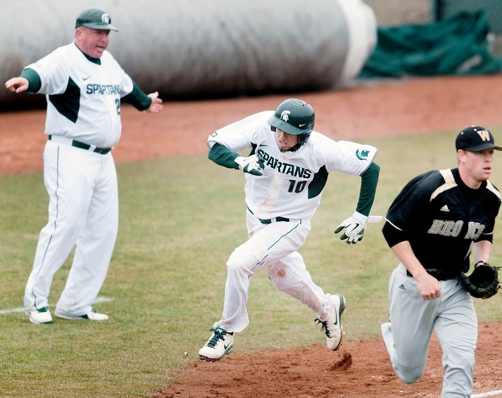 	<p>Sophomore infielder Ryan Richardson rounds third base for a run Tuesday, April 9, 2013, at McLane Baseball Stadium at Old College Field. The Spartans defeated Western Michigan 10-1. Danyelle Morrow/The State News</p>