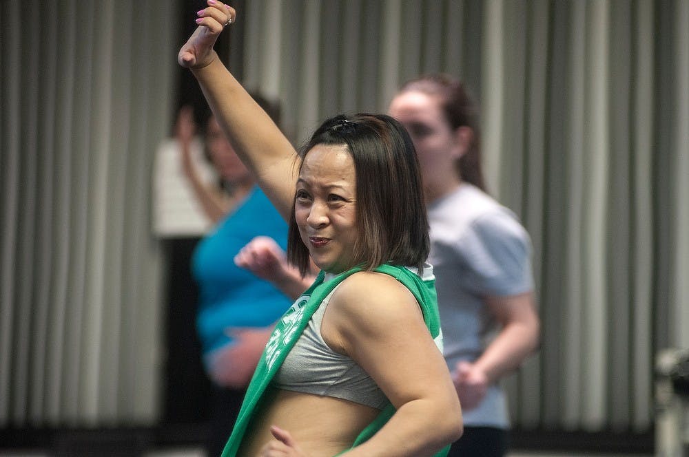 <p>East Lansing resident and MSU alumna Becky Newcombe leads a zumba step class Jan. 27, 2015, at Spartan Fit Center, 3498 Lake Lansing Rd. Spartan Fit Center offers a wide variety of classes and opened just last year. It branched off of Spartan Dance Studio, which is located right next door. Allyson Telgenhof/The State News.</p>