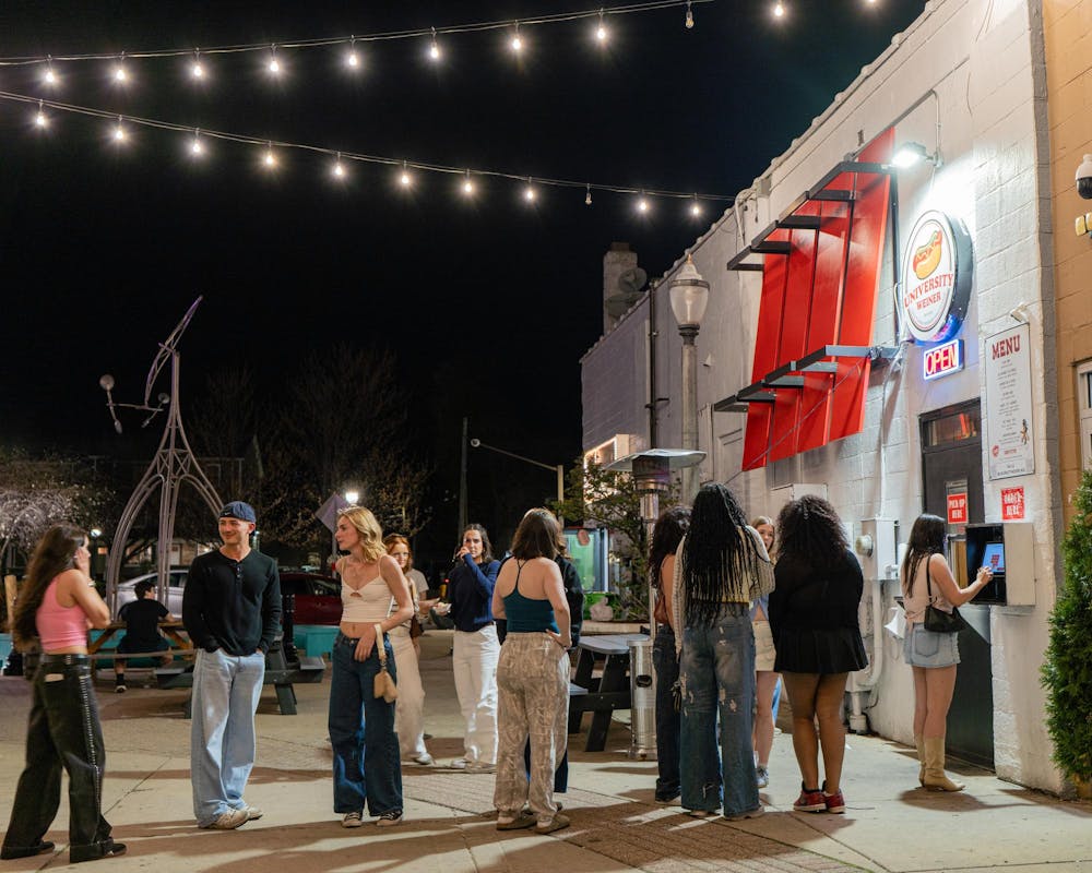 <p>Michigan State University students wait in an alley way to order their hot dogs from University Weiner in East Lansing, MI on April 17, 2026.</p>