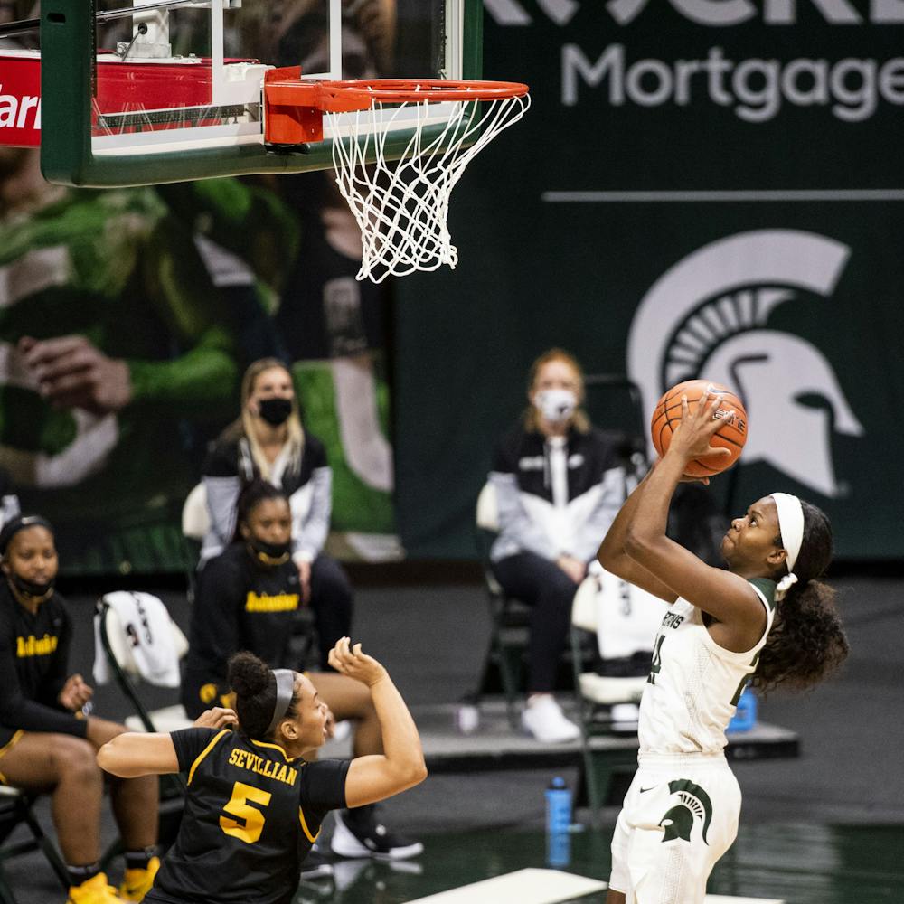 <p>Junior guard Nia Clouden (24) shoots for a basket during a game against Iowa on Dec. 12, 2020 at the Breslin Center. The Spartans defeated the Hawkeyes 86-82.</p>