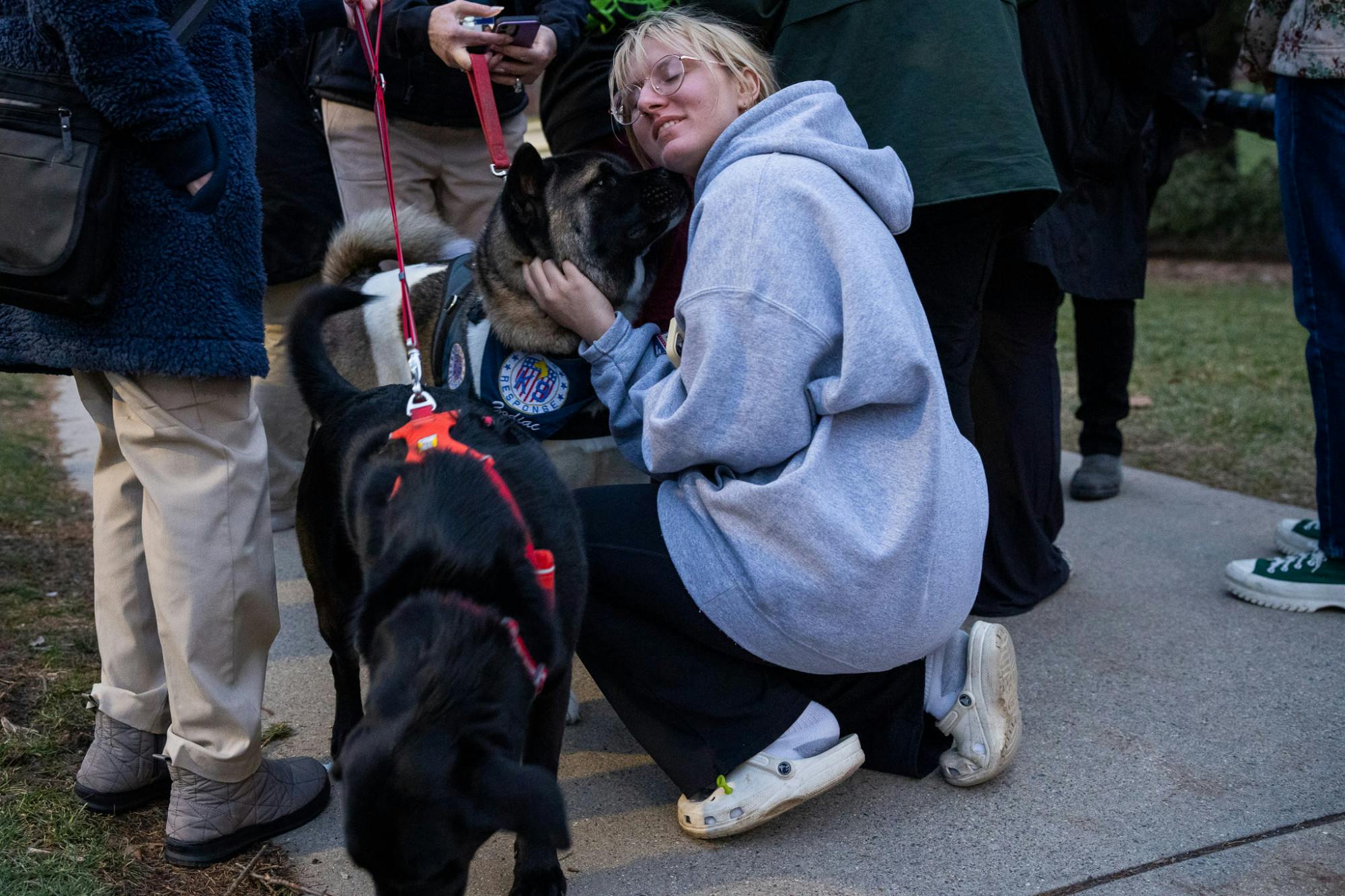 <p>ASMSU President Jo Kovach enjoys the company of Crisis Response Canine Mika on Feb. 14, 2023. Crisis Response Canines visited MSU at the Spartan Statue to provide support for students after a mass shooting took place on campus on Feb. 13, 2023. </p>