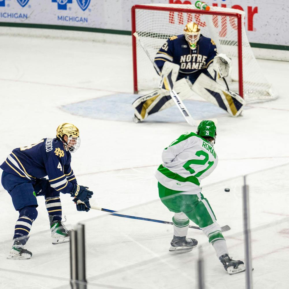 MSU Fr. F, Anthony Romani (21), takes a shot on Notre Dames goalie in Munn Ice Arena in East Lansing, MI on Feb. 19, 2026.