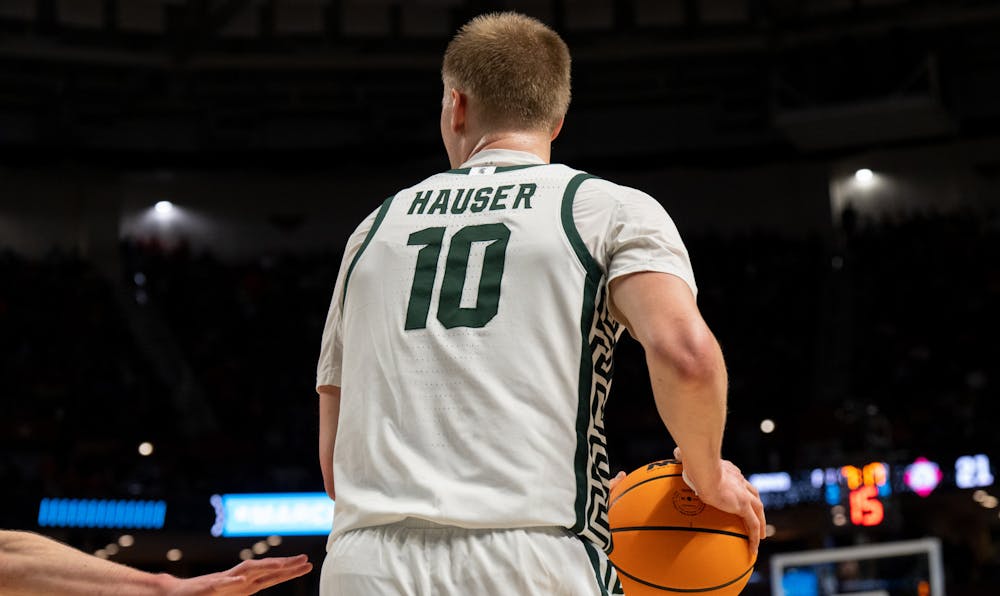 <p>Redshirt senior forward Joey Hauser (10) defends the ball during Michigan State&#x27;s win over the Davidson Wildcats on March 18, 2022.</p>