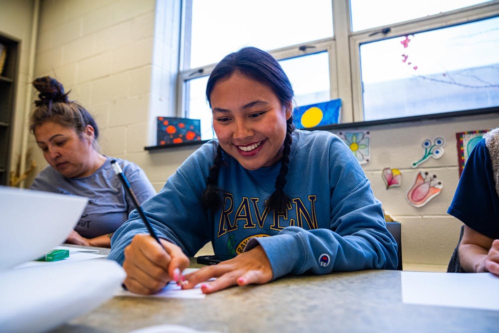 An MSU student sketches a design during a beading workshop held at the Urban Planning and Landscape Architecture building on Nov. 19, 2024.