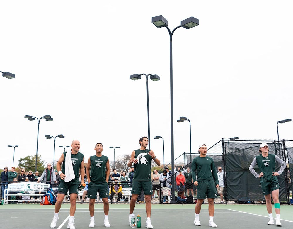<p>MSU tennis team cheering on doubles as the Men's MSU tennis team takes on Illinois University at home on April 21, 2023.</p>