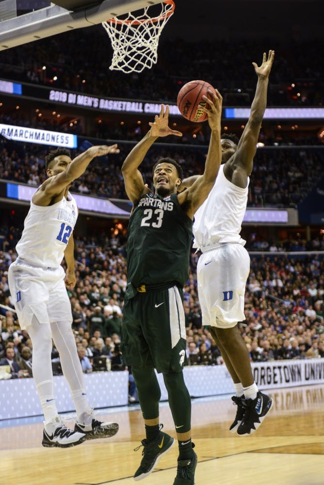 <p>Sophomore forward Xavier Tillman (23) shoots the ball during the game against Duke on March 31, 2019 at Capital One Arena. The Spartans defeated the Blue Devils, 68-67. The Spartans are the East Regional Winners and are headed to the Final Four.</p>