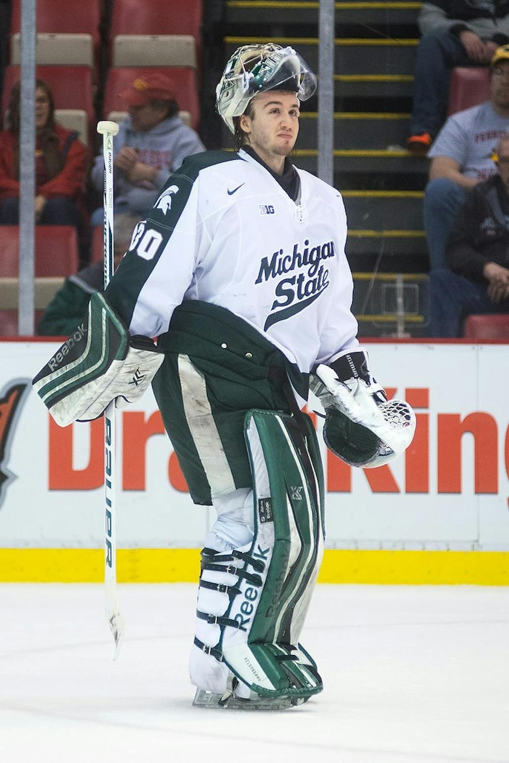 <p>Junior goaltender Jake Hildebrand reacts to a Spartan goal on an empty Ferris State net Dec. 28, 2014, during the 50th Great Lakes Invitational at Joe Louis Arena in Detroit. The Spartans defeated the Bulldogs, 2-0. Danyelle Morrow/The State News</p>