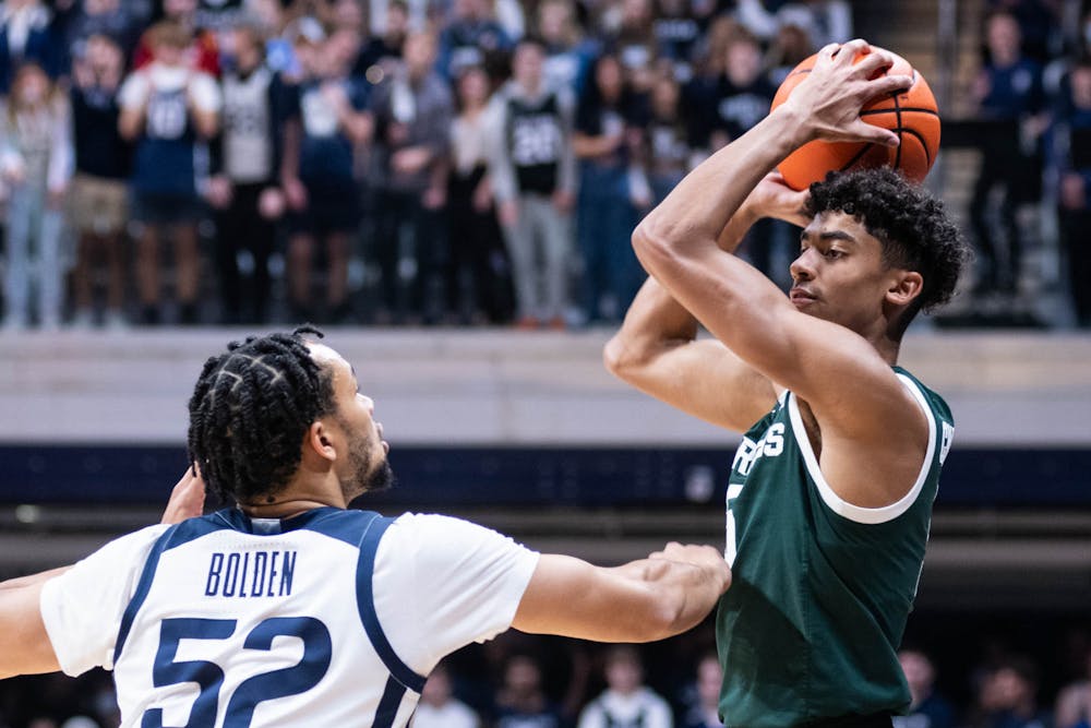 <p>Freshman guard Max Christie (5) shoots the ball during the game against Butler on Nov. 17, 2021, at the Hinkler Fieldhouse. The Spartans defeated the Bulldogs 73-52. </p>