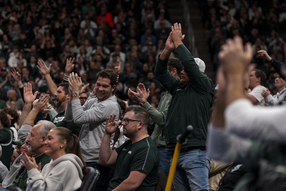 <p>Michigan State fans cheer after the Spartans make a basket at Little Caesars Arena in Detroit on Dec. 17, 2024. The Spartans defeated the Golden Grizzlies 77-58.</p>