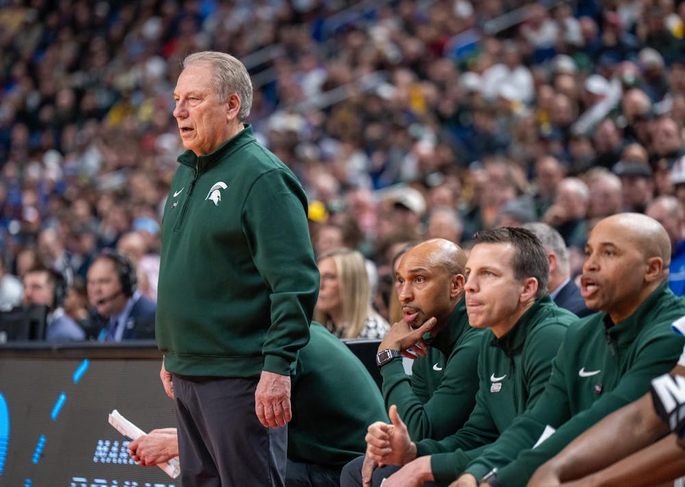 Michigan State men’s basketball coaches watch their March Madness matchup against the University of Louisville at KeyBank Center in Buffalo, New York on March 21, 2026.