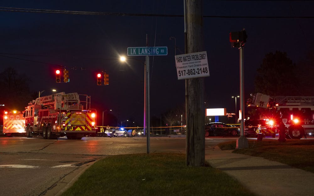 East Lansing Fire and Police Departments respond to a car accident at the intersection of Lake Lansing and Coolidge roads on Wednesday, April 5, 2023. 