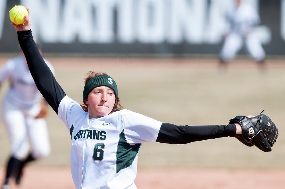 	<p>Junior pitcher Kelly Smith pitches during a game against Indiana on March 31, 2013, at Secchia Stadium at Old College Field. The Spartans won, 2-1. Julia Nagy/The State News</p>