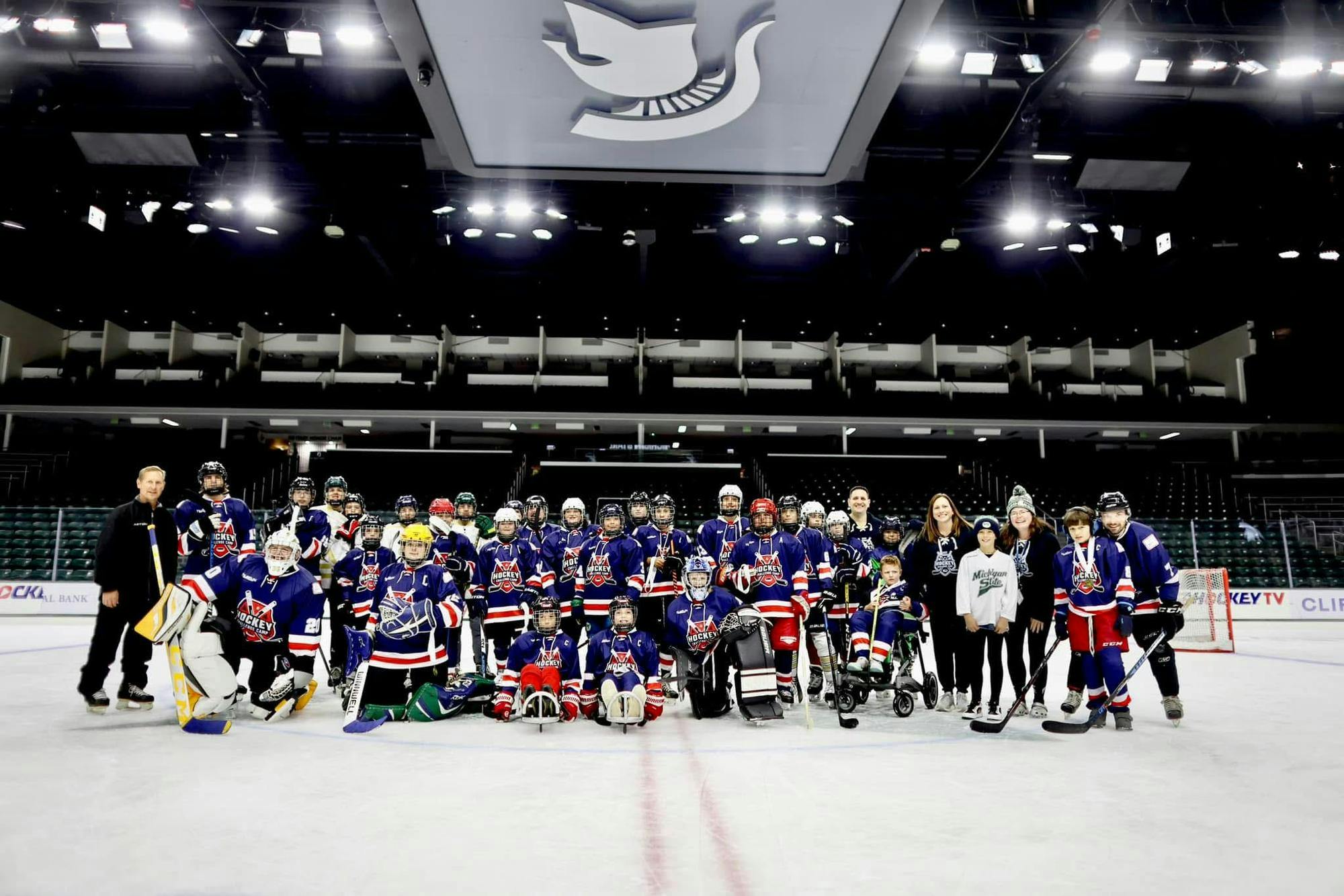 <p>Members of the SAFE program pose for a photo in Munn Ice Arena. Photo courtesy of Sarah Dunkel-Jackson.</p>
