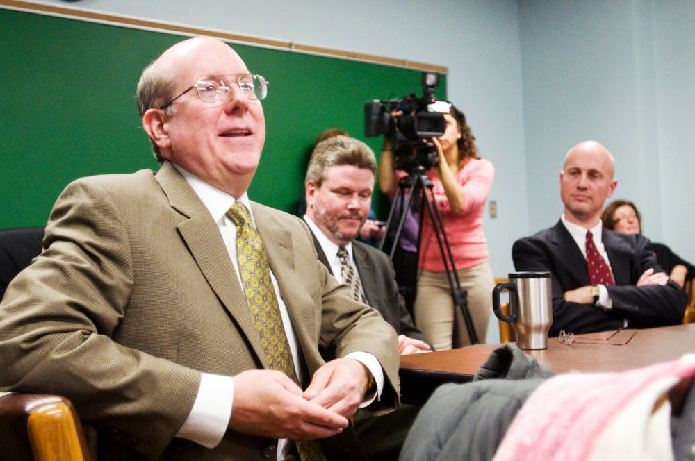 Eliot Ryser, a professor of food science and human nutrition, speaks about what he intends to do with his $1.8 million grant Wednesday in Anthony Hall. Ryser and fellow food science and human nutrition professor Les Bourquin, center, as well as Brad Marks, a professor of biosystems engineering, right, all received grants from the United States Department of Agriculture to research food safety. Matt Radick/The State News