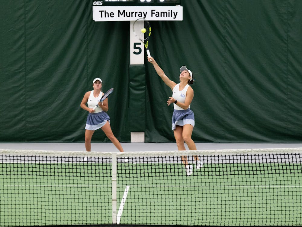 UCLA’s Anne-Christine Lutkemeyer (senior) and Mayu Crossley (freshman) compete in a doubles match at the MSU Tennis Complex on Sunday, Mar. 22, 2026.