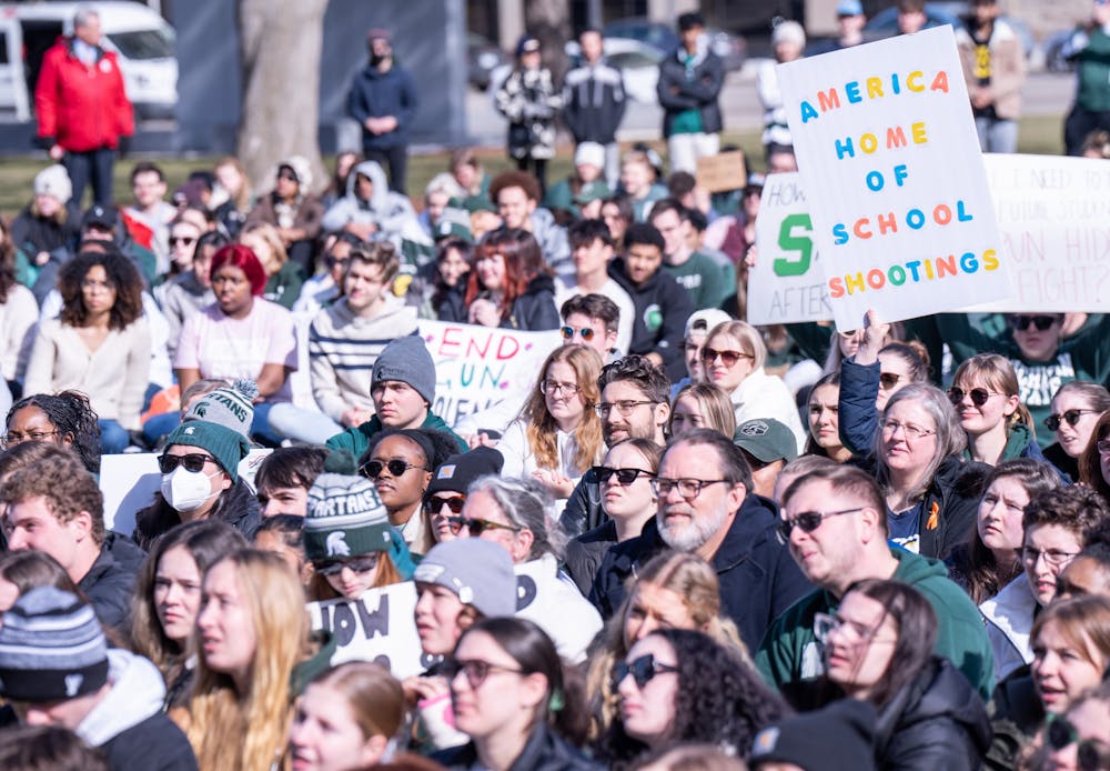 <p>MSU students hold up signs protesting against gun violence during the sit-in protest at the Michigan State Capitol in Lansing on Feb. 20, 2023.</p>
