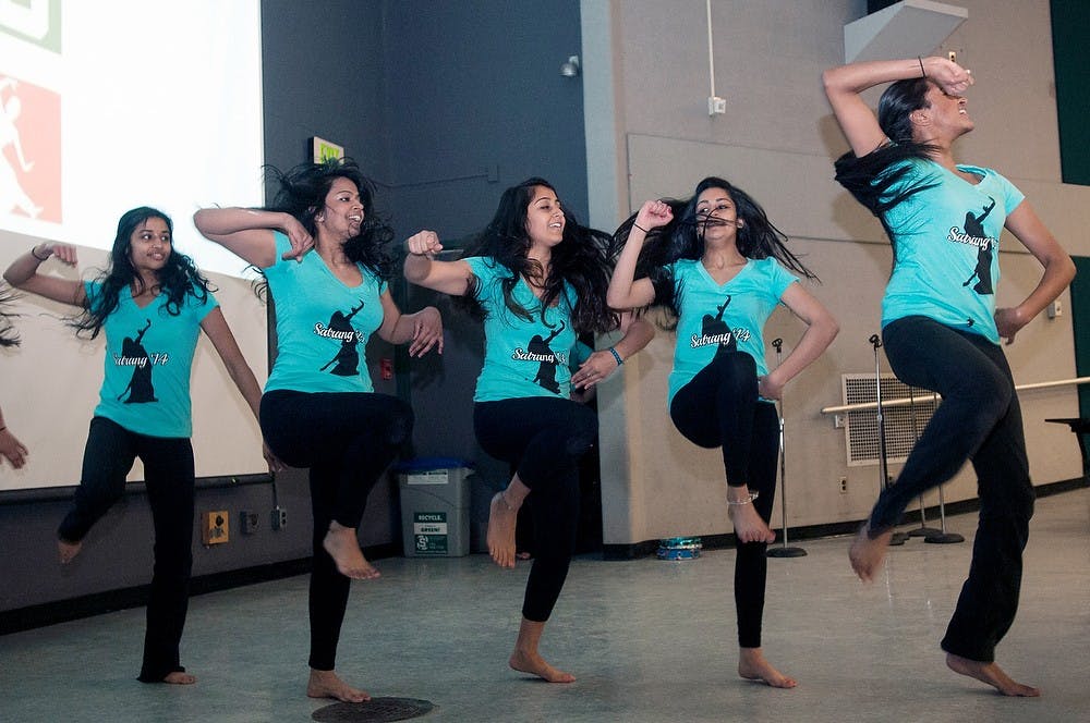 <p>CIUS members perform a portion of their dance for Satrang, an Indian cultural dance show, at the "Healing Through the Arts: Melodies for Muscles" event on March 22, 2014.   The event included performances from various dance and singing groups around campus. Allison Brooks/The State News</p>