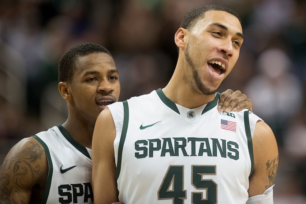 	<p>Senior guard Keith Appling, left, congratulates sophomore guard Denzel Valentine on making a free throw Jan. 21, 2014, at Breslin Center during the game against Indiana. The Spartans defeated the Hoosiers, 71-66. Julia Nagy/The State News</p>