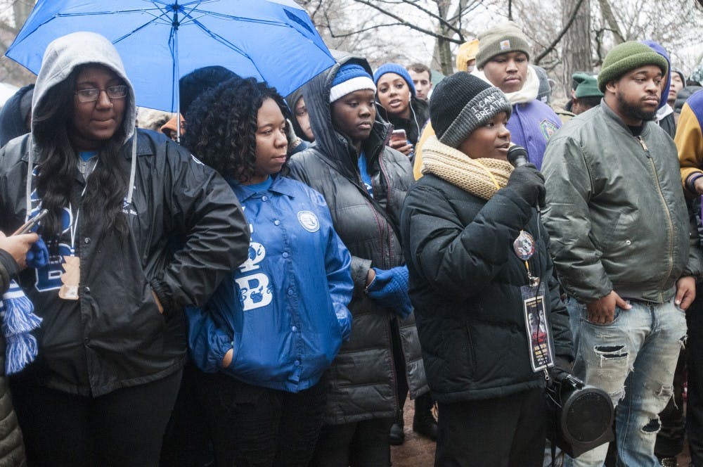 Lansing resident Noah Yarborough, 12, center-right, recites the "I Have a Dream" speech during the MLK Commemorative March for Justice on Jan. 16, 2017 at Beaumont Tower. Students, professors and other allies marched in commemoration of the values held by Dr. Martin Luther King Jr. from the Union to Beaumont Tower. Yarborough has engaged in public speaking since the age of 3 and reciting this particular speech since the age of 5. 