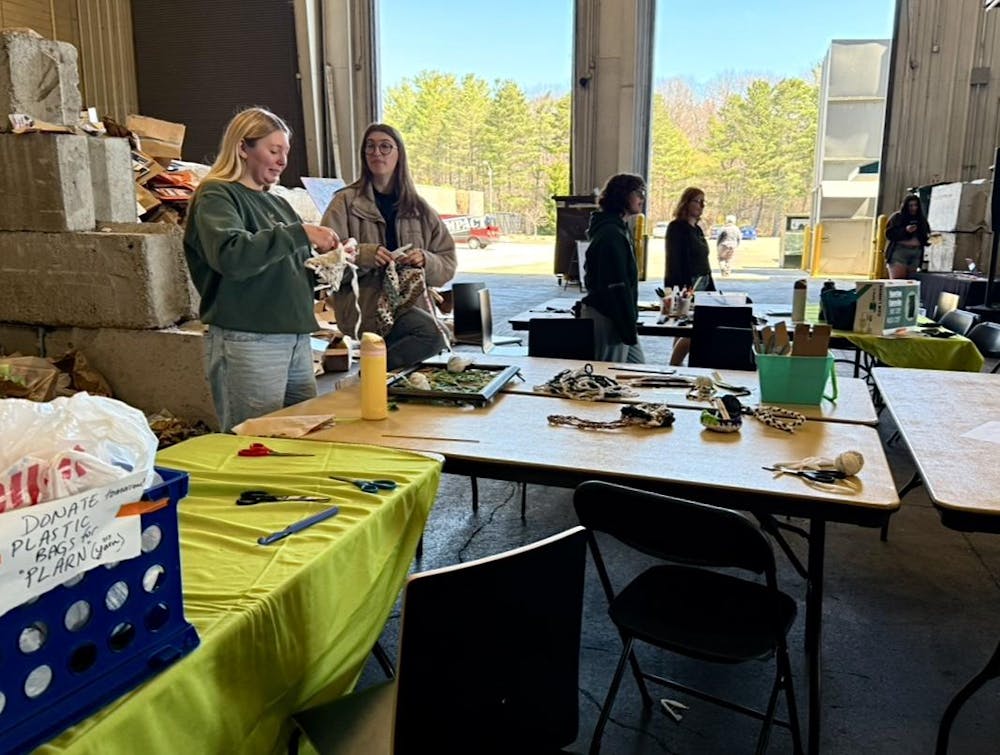 Attendees at look at the various tables and activities at the MSU Earth Bash at the Surplus Store on April 12, 2025