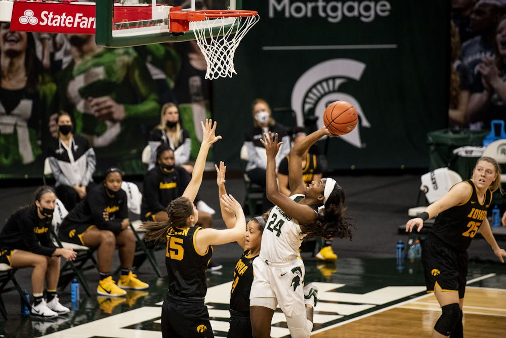 <p>Junior guard Nia Clouden (24) shoots for a basket during the game against Iowa on Dec. 12, 2020, at the Breslin Center. The Spartans defeated the Hawkeyes 86-82.</p>