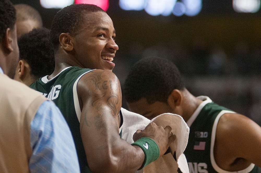 	<p>Senior guard Keith Appling laughs during a timeout in the game against Oakland on Dec. 14, 2013, at The Palace of Auburn Hills in Auburn Hills, Mich. The Spartans defeated the Grizzlies, 67-63. Danyelle Morrow/The State News</p>