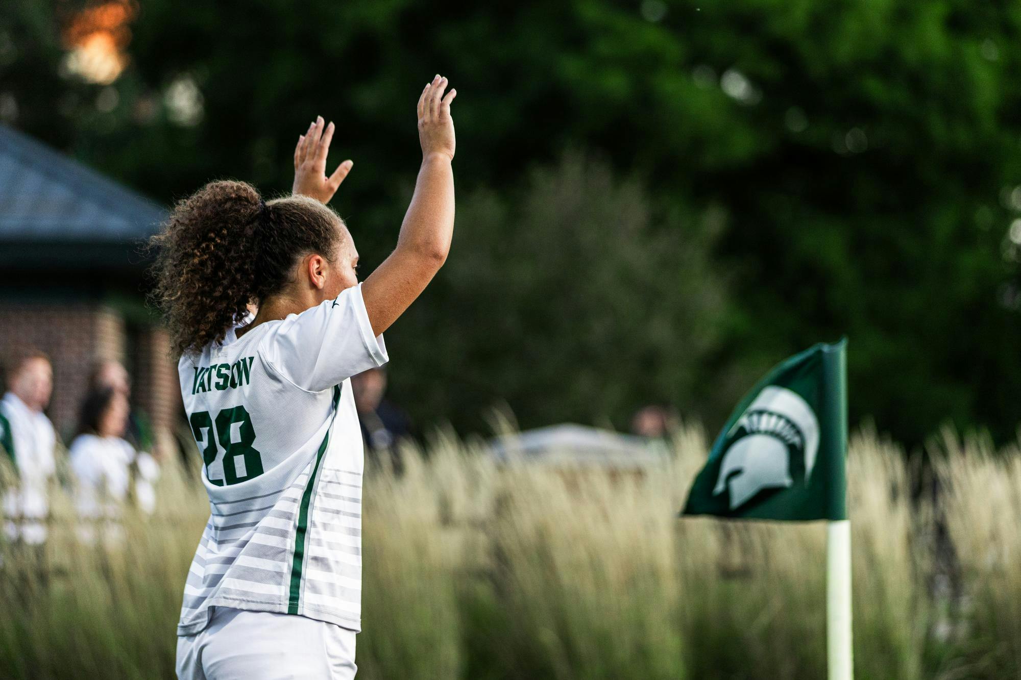 Michigan State player, 28 Renee Watson, takes a corner kick