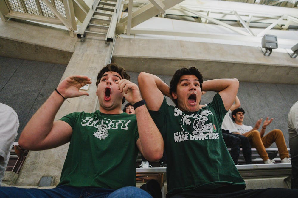 <p>MSU upper bowl Izzone students react to a Coen Carr slam dunk, as MSU faces Bowling Green at the Breslin Center on Nov. 16, 2024</p>