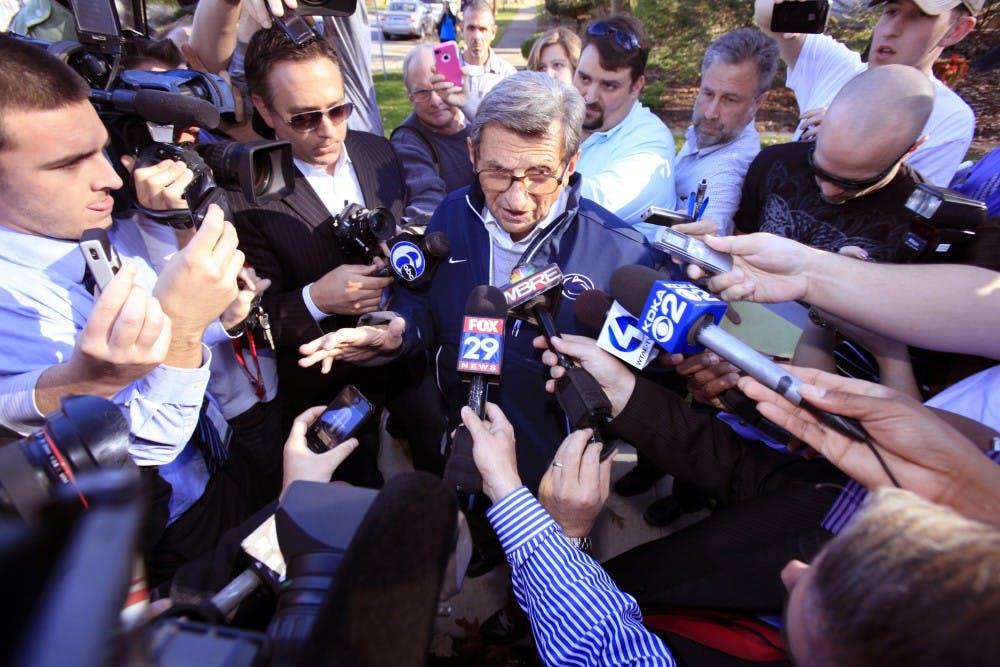 Penn State football coach Joe Paterno briefly answers a few questions before leaving his house for practice on November 8, 2011, in State College, Pa. (David Swanson/Philadelphia Inquirer/TNS)