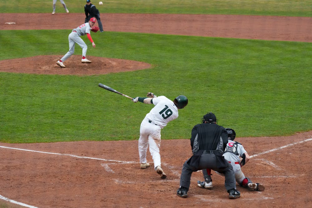 <p>Michigan State redshirt freshman Bryan Broecker smashes the ball down the center at McLane Baseball Stadium on March 30, 2022. Spartans are victorious 12-5 against Youngtown State.</p>