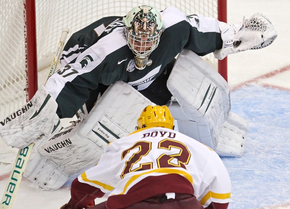 	<p>Michigan State goaie Will Yanakeff defends against Travis Boyd of Minnesota in the second period on Friday, October 12, 2012, in Minneapolis, Minnesota. Bruce Bisping/Minneapolis Star Tribune/MCT</p>