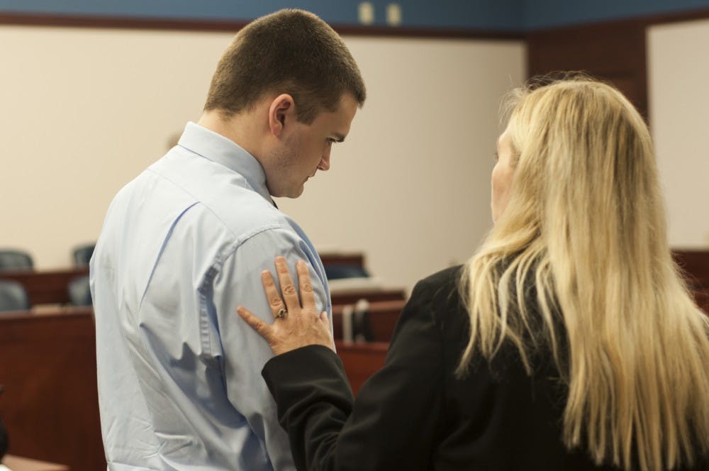 	<p>Okemos resident and alleged murderer Connor McCowan and defense attorney Linda Widener talk after Friday&#8217;s trial testimony in Ingham County Circuit Court concludes. Margaux Forster/The State News</p>