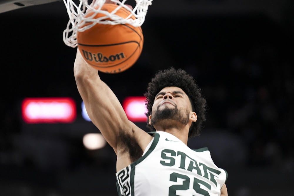 <p>Graduate student forward Malik Hall, No. 25, dunks the ball during a game against University of Minnesota during the Big Ten Tournament in Minneapolis. The 8th seeded Spartans are looking to advance over the 9th seeded Golden Gophers to advance to the Big Ten Quarterfinals.</p>