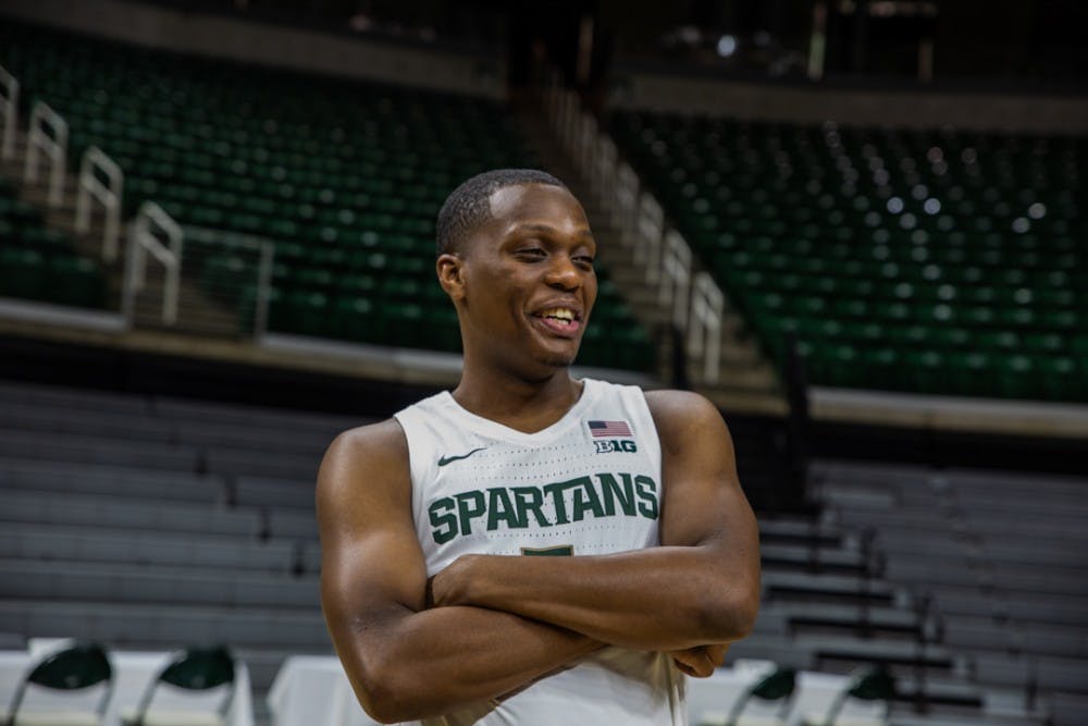 Senior guard Cassius Winston (5) laughs during MSU basketball media day on Oct. 15, 2019 at the Breslin Center.