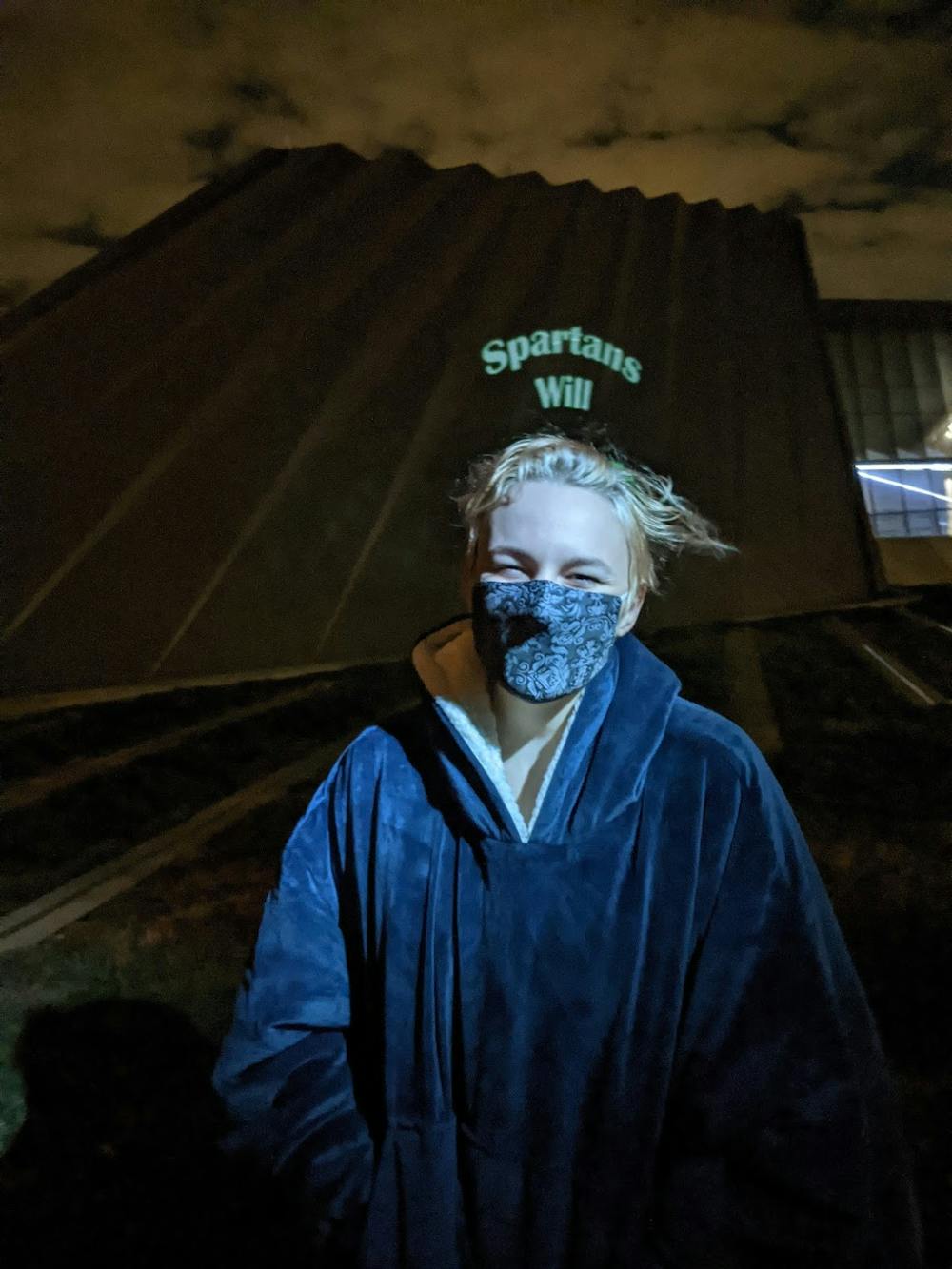 <p>Graduate student and teaching assistant in the Department of Theatre Rose Legge created her own project called “Vote Your Voice," which was projected on the side of the Broad Art Museum. Photo courtesy of Alison Dobbins</p>
