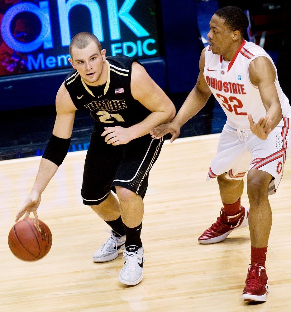 Purdue guard DJ Byrd dribbles against Ohio State guard Lenzelle Smith Jr. during last season's Big Ten Tournament at Bankers Life Fieldhouse in Indianapolis on March 9, 2012. This year's tournament will be held in Chicago. State News File Photo