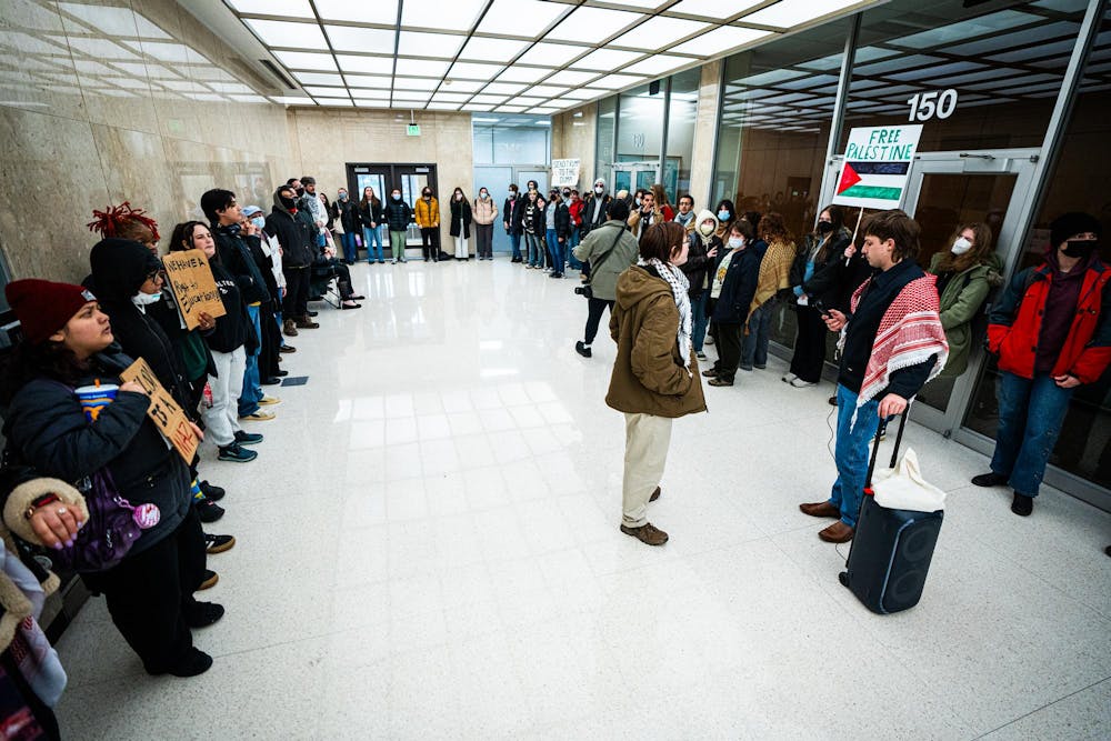 <p>Student protesters gather into a circle during a Hurriya Coalition protest at the Hannah Administration building on April 10, 2025.</p>