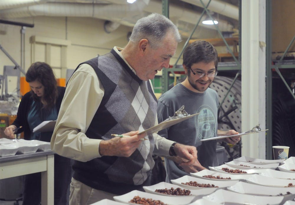 Plant soil and microbial sciences professor Jim Kelly, left and graduate student Nolan Bornowski collect data on Feb. 4, 2016 at the Agronomy Farm on 4856 Beaumont Road in Lansing, Mich. Kelly and his students were working on a canning evaluation of various beans.