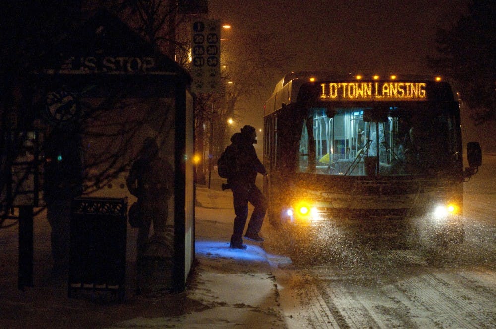 <p>Snowfall at a CATA bus station. Josh Radtke/The State News</p>