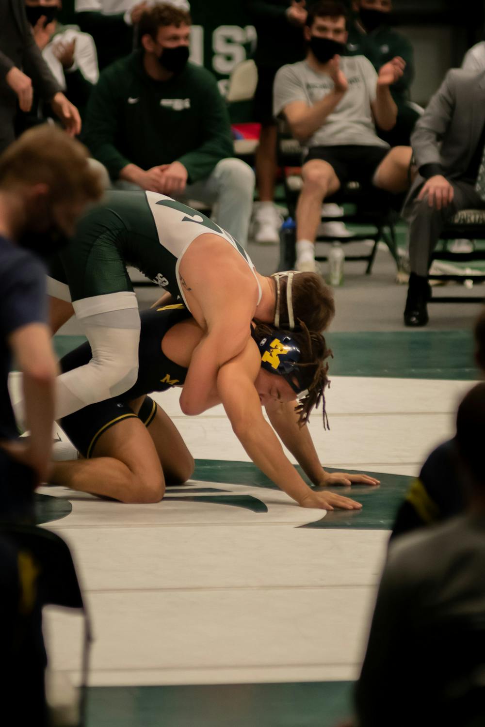 Redshirt sophomore and No. 13-ranked Layne Malczewski holds top position on freshman Jaden Bullock on Feb. 19, 2021. Malczewski was one of the just three individual wins for the Spartans against the No. 4-ranked Wolverines.