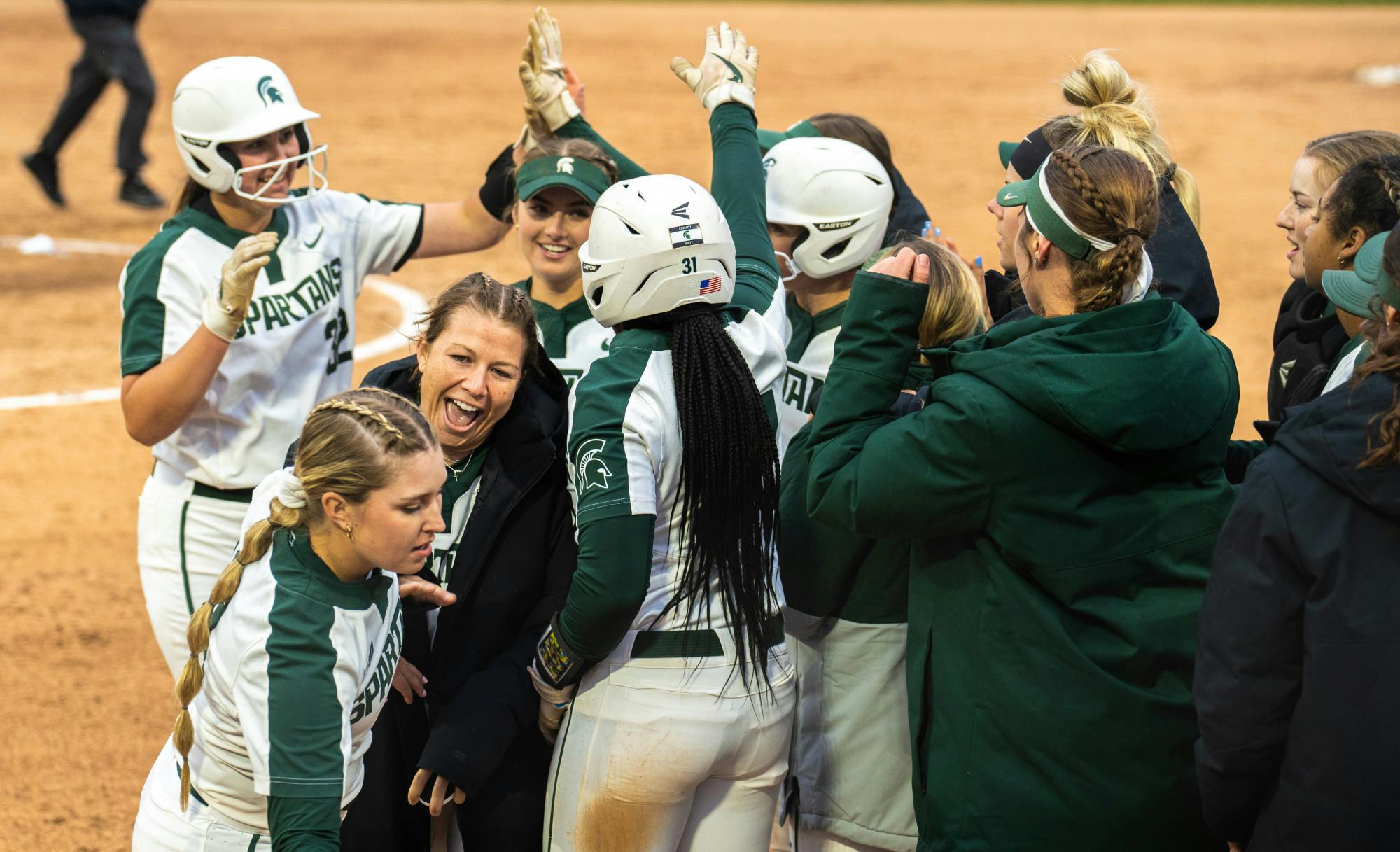 <p>Michigan State celebrates their win after the game ended due to the mercy rule. The Spartans shut out the Chippewas, 8-0, in a six-inning game on March 22, 2022. </p>