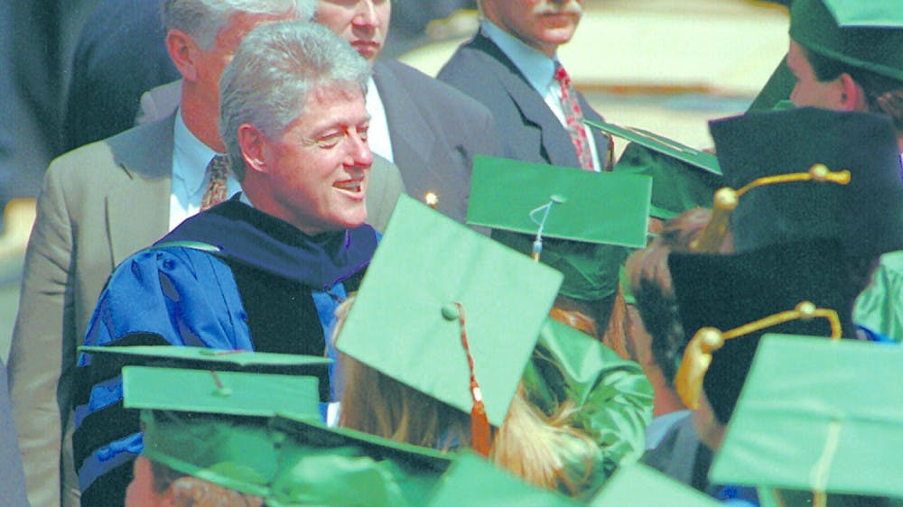 <p>President Bill Clinton greets graduates during commencement ceremonies May 5, 1995&nbsp;at Spartan Stadium.</p>