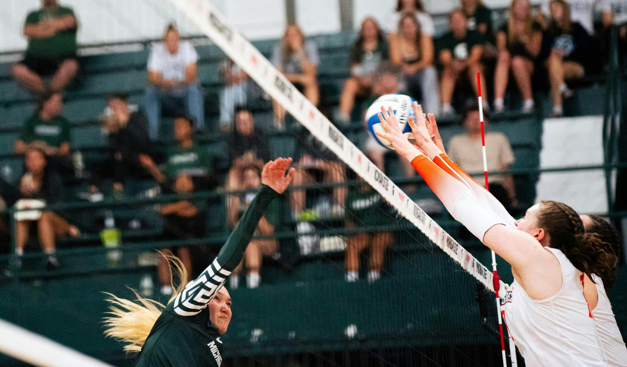 Bowling Green defends against a spike