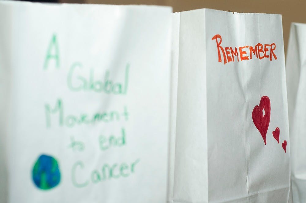 <p>Decorated luminaries sit around the restaurant during the kickoff party on Feb. 26, 2014, at Midtown Beer Company, 402 S. Washington Square in Lansing. The Relay For Life event will be held on June 27 and 28 at Cooley Law Stadium. Danyelle Morrow/The State News</p>