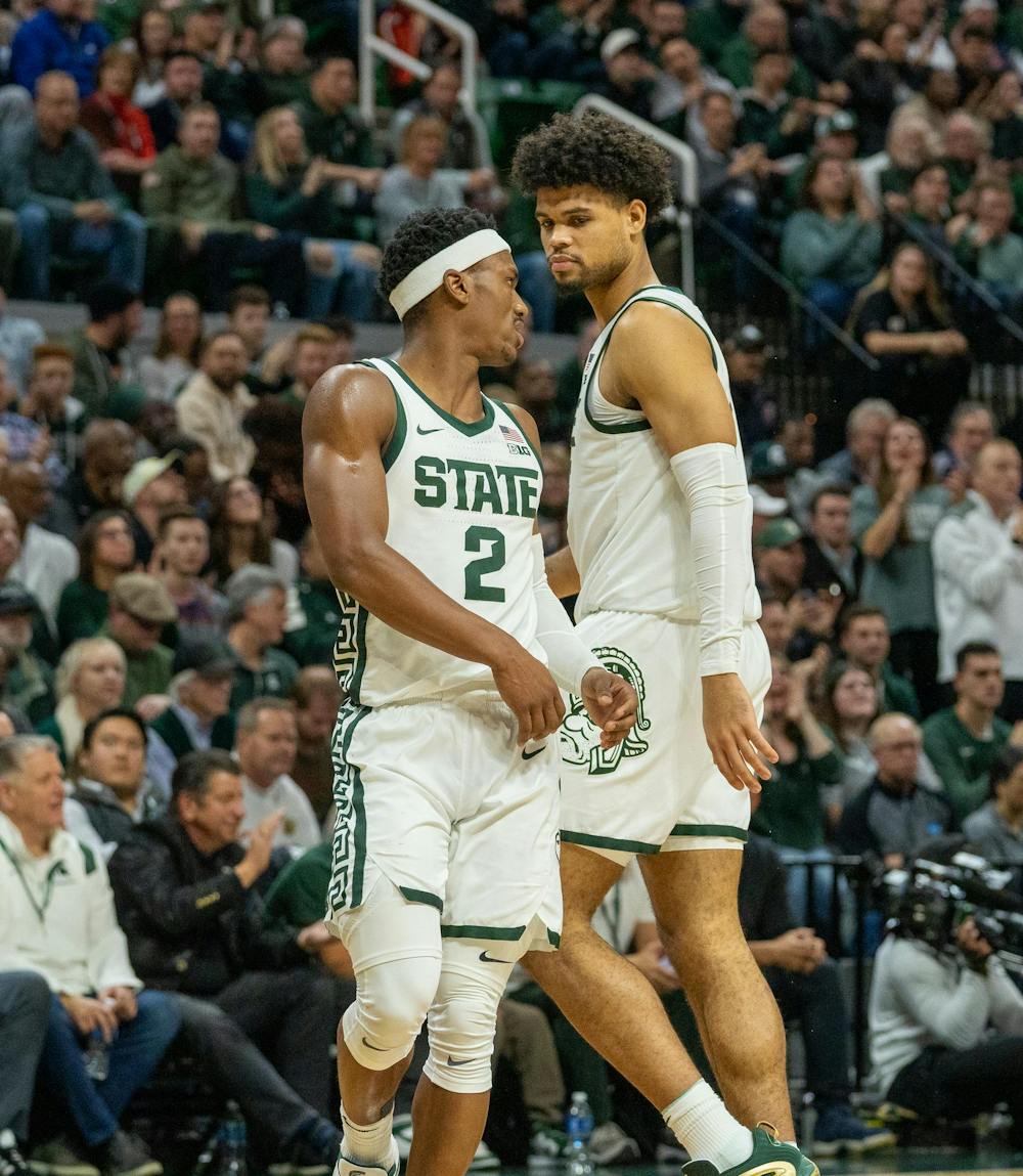 <p>MSU Graduate Student Guard Tyson Walker (2) and Graduate Student Forward Malik Hall (25) discussing with each other during their game matchup against Wisconsin held at the Breslin Center on Dec. 5, 2023. MSU would go on to lose 57-70 against 23 Wisconsin.</p>