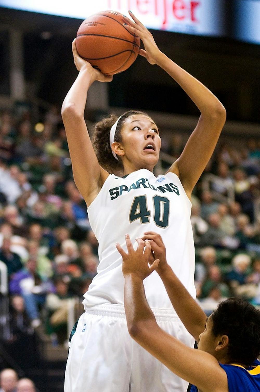 Then-redshirt-freshman center Madison Williams shoots over Lake Superior State guard Raven Trammell on Nov. 3, 2011, at the Breslin Center. The Spartans defeated the Lakers 94-31. State News File Photo