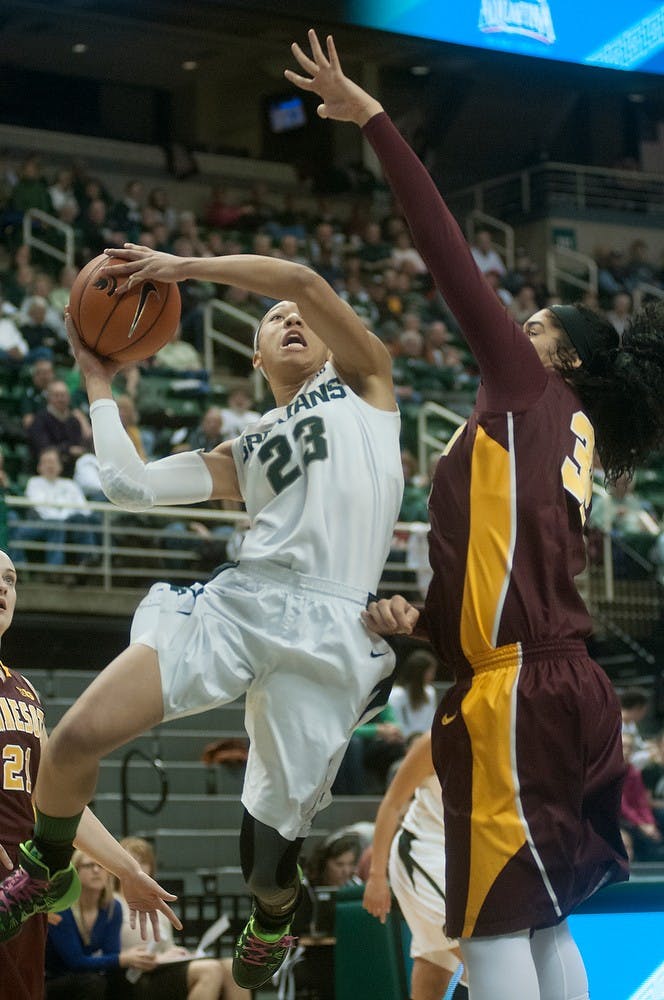 	<p>Redshirt freshman guard Aerial Powers goes up to the basket as Minnesota center Amanda Zahui B. guards Feb. 24, 2014, at Breslin Center. The Spartans lead at half 44-33. Julia Nagy/The State News</p>